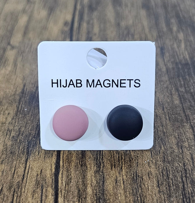 Hijab magnets on a card with 'Hijab Magnets' text on a wooden surface