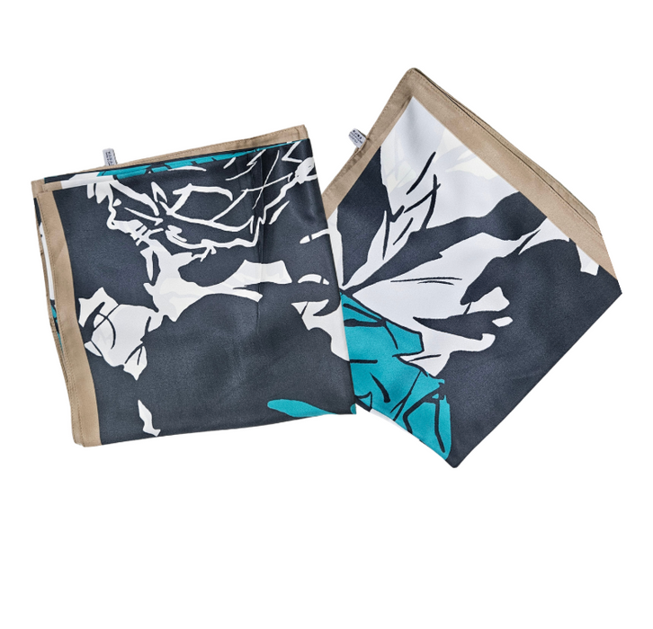 Silk scarf with leaf pattern on a white background