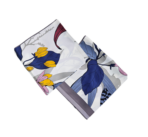 Floral patterned fabric square on a white background